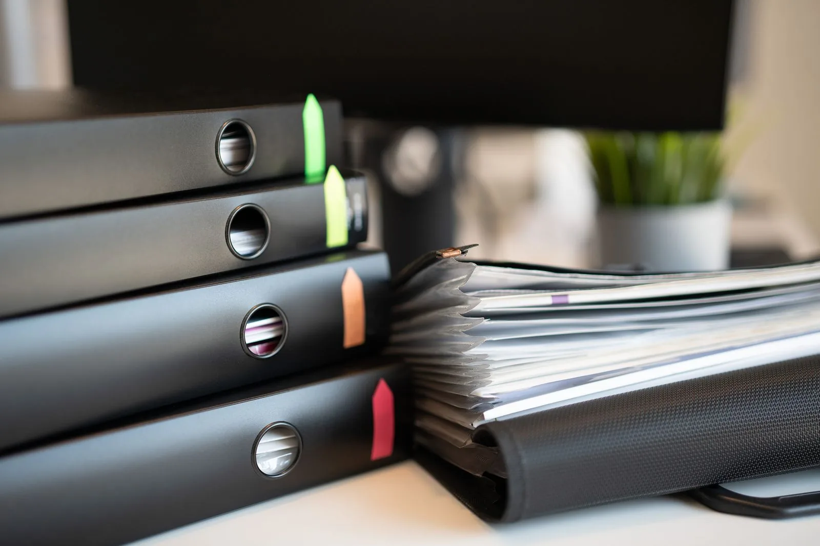 Corporate binders and records of a Quebec corporation on a lawyer's desk